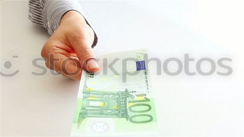 Image, Stock Photo Payday | hands of a young woman and many banknotes standing on the table before her.