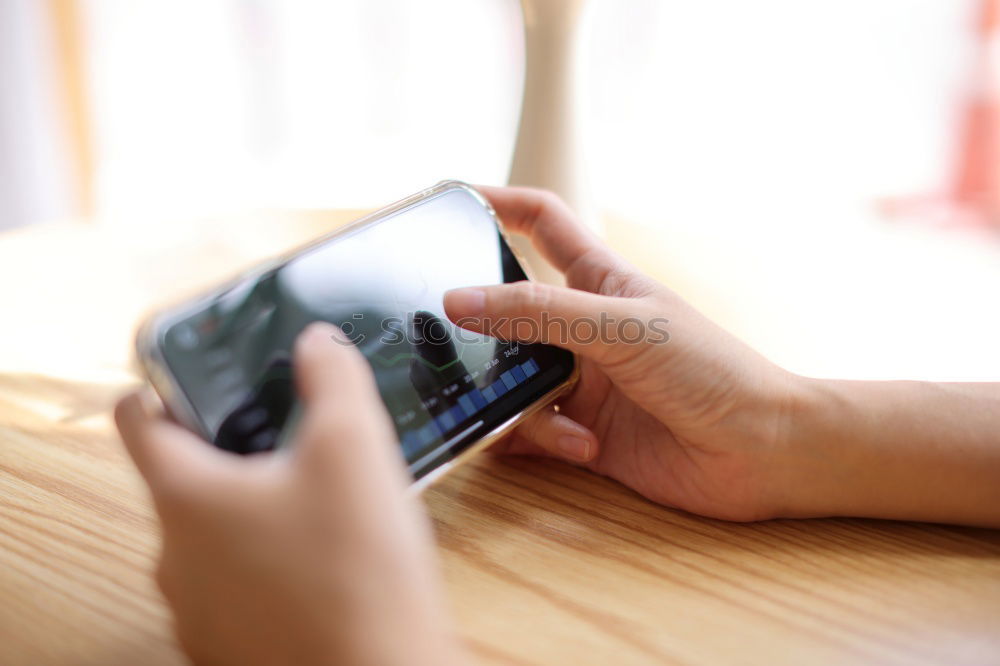 Close up of hands using smartphone