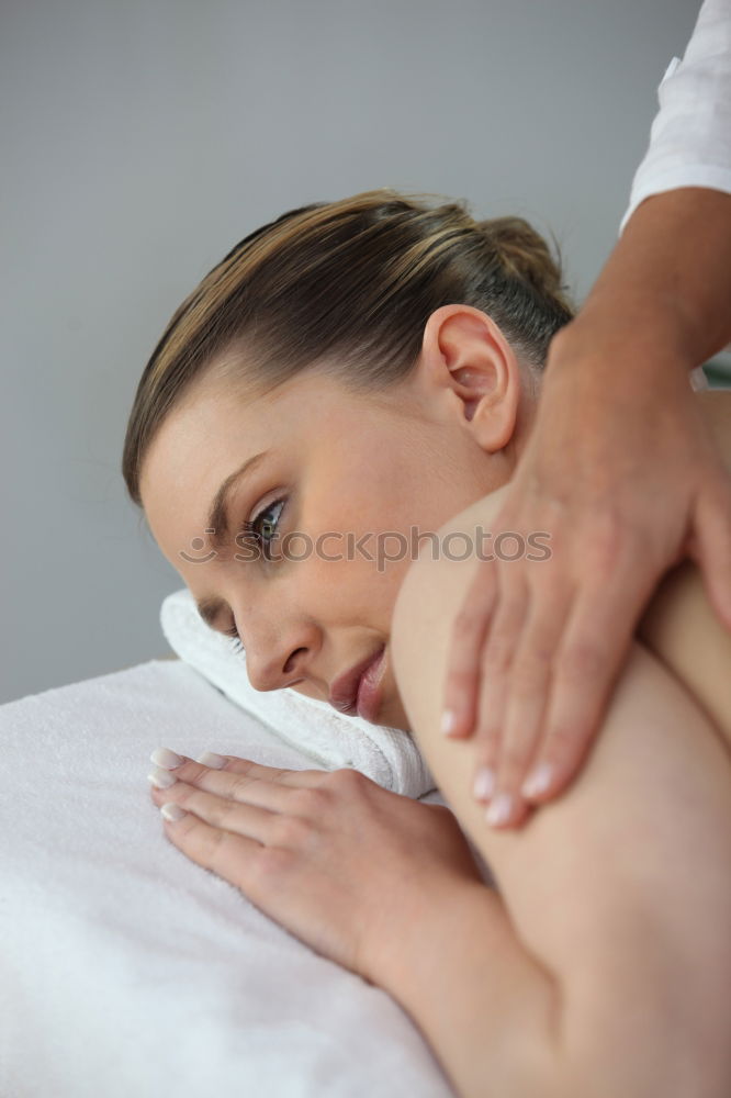 Similar – Image, Stock Photo Woman receiving back massage on clinical center