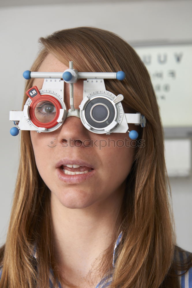 woman covering her eye with piece of sushi