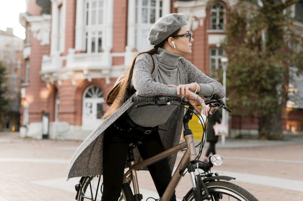 Similar – Happy family with a child riding bicycles by the city