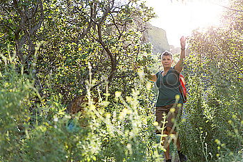 Similar – Image, Stock Photo Couple doing trekking looking with binoculars