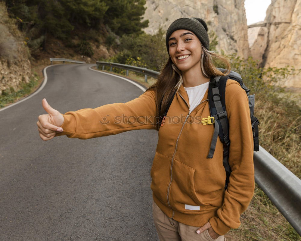 Similar – Man with camera walking in a rural road