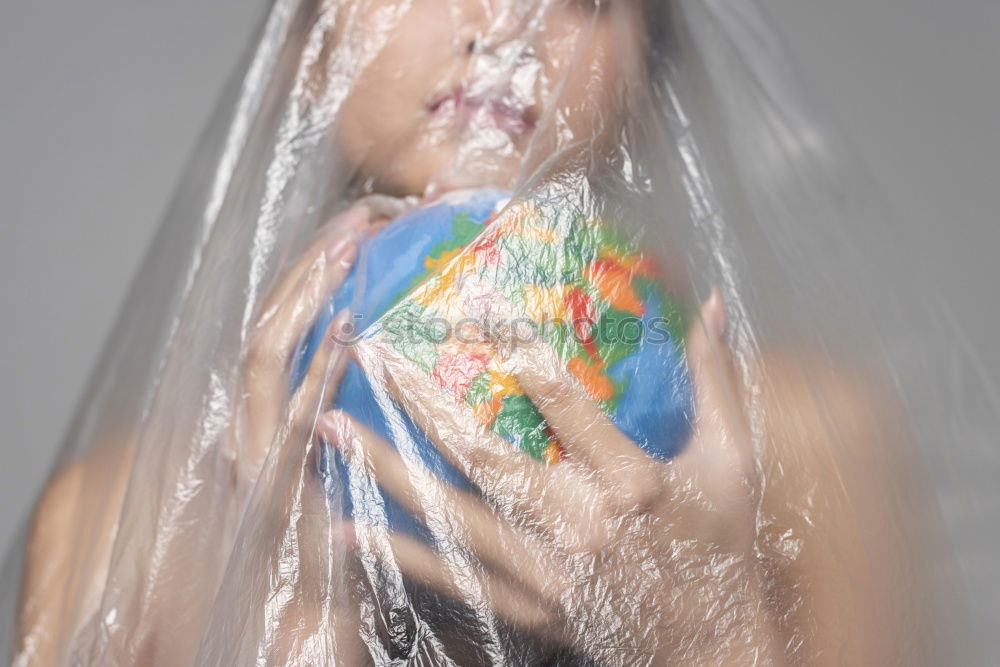 Similar – Thoughtful, dreamy, sweet girl with a white balloon in her hand in the garden, looks into the camera. Dear birthday girl outside in the nature is happy about a gift balloon for her party, holds it tight and puts it in her mouth.