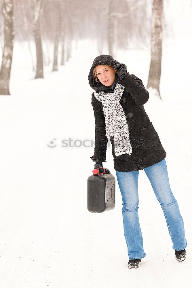 Similar – Teenage girl pulling sled with her little sister through forest