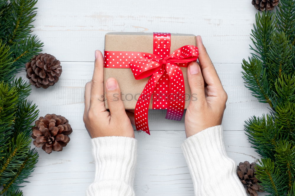 Similar – Woman arms doing christmas decoration in a wood table outdoors