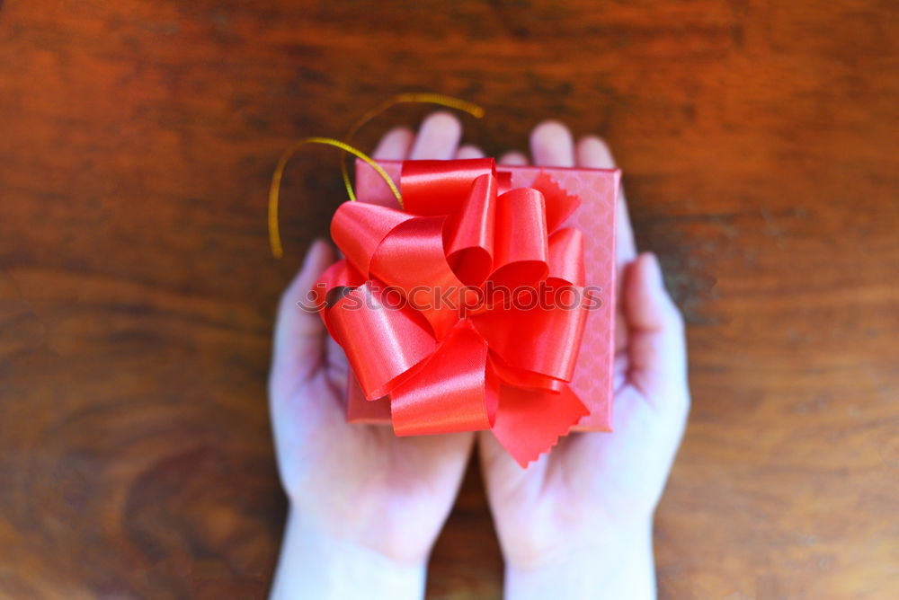 Similar – Image, Stock Photo colourful christmas parcels packed with christmas paper with red bow, on rustic wood. Christmas presents, lie nicely decorated with ribbon on wooden table. Many Christmas parcels wrapped with wrapping paper with Christmas motif. Concept gifts Advent.