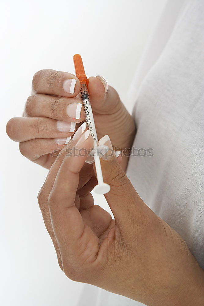 Similar – Hand with syringe and dog preparing for vaccine injection