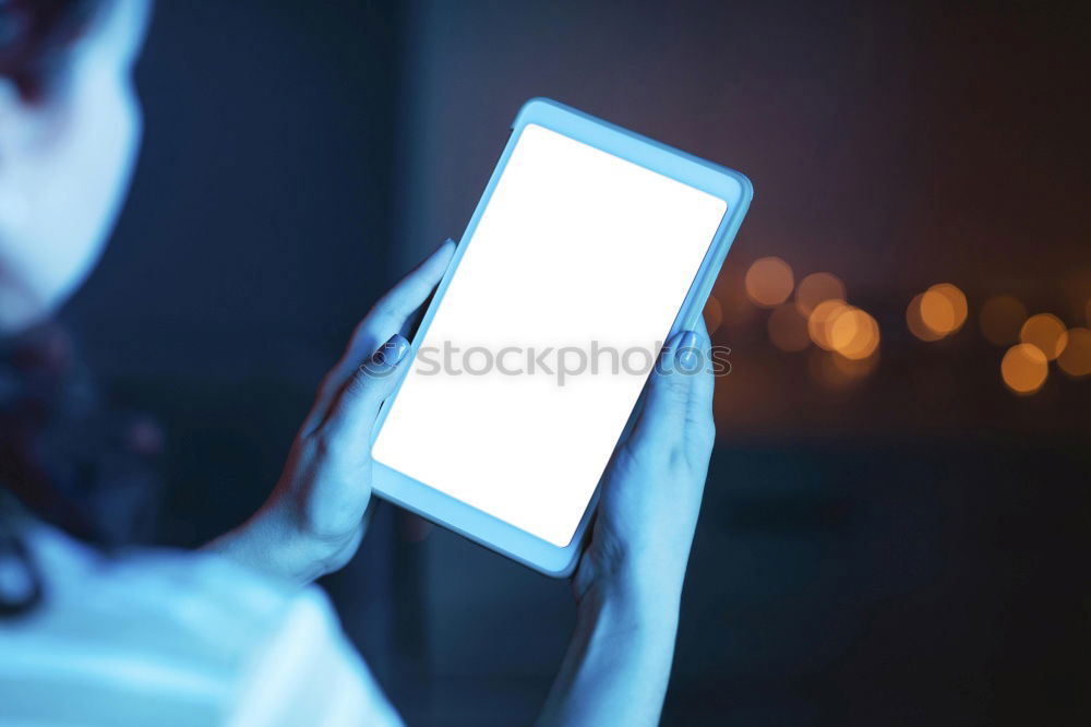 Similar – Image, Stock Photo Young people using tablet computer at home. They looking at pictures standing by the window in the evening. City lights outdoor