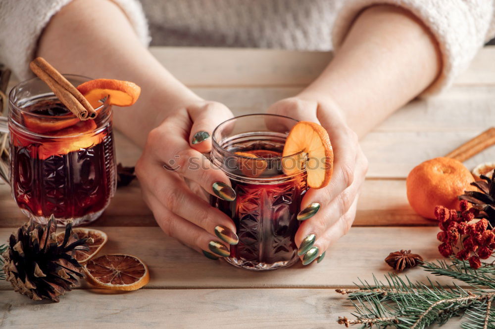 Similar – female hands holding an iron mug with carrot juice