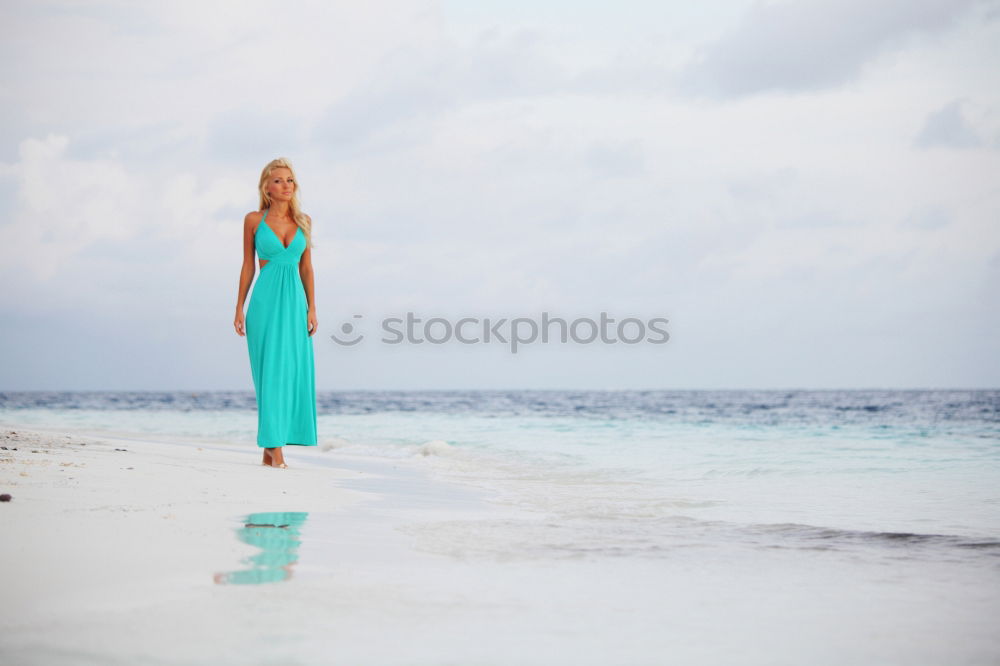 Similar – Image, Stock Photo Group of younf adult friends walking on the beach