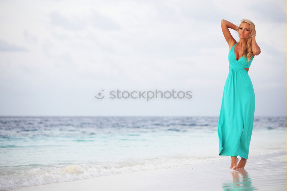 Similar – Image, Stock Photo woman with long pink dress on a tropical beach