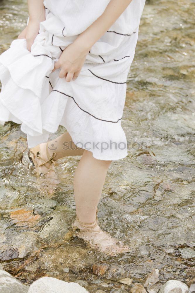 Similar – baby walking barefoot on stones