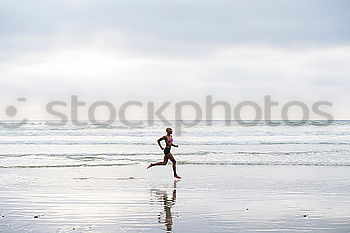 Similar – Person with surfboard walking near sea