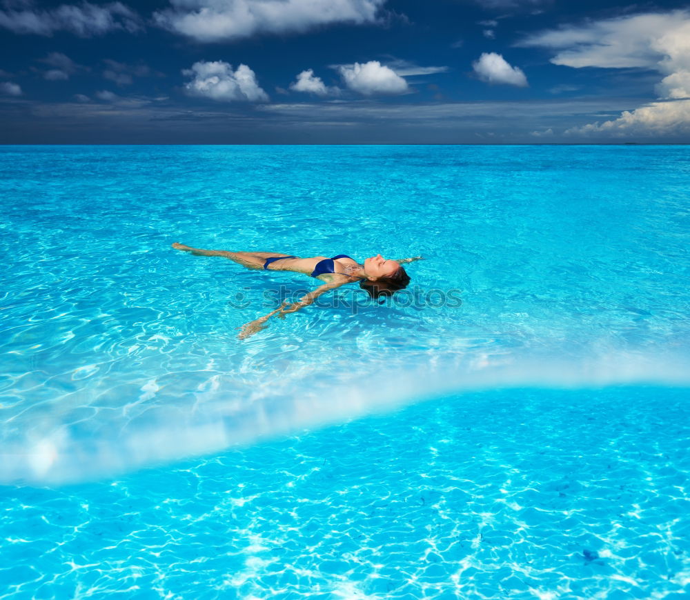 Similar – Woman in lagoon on tropical island