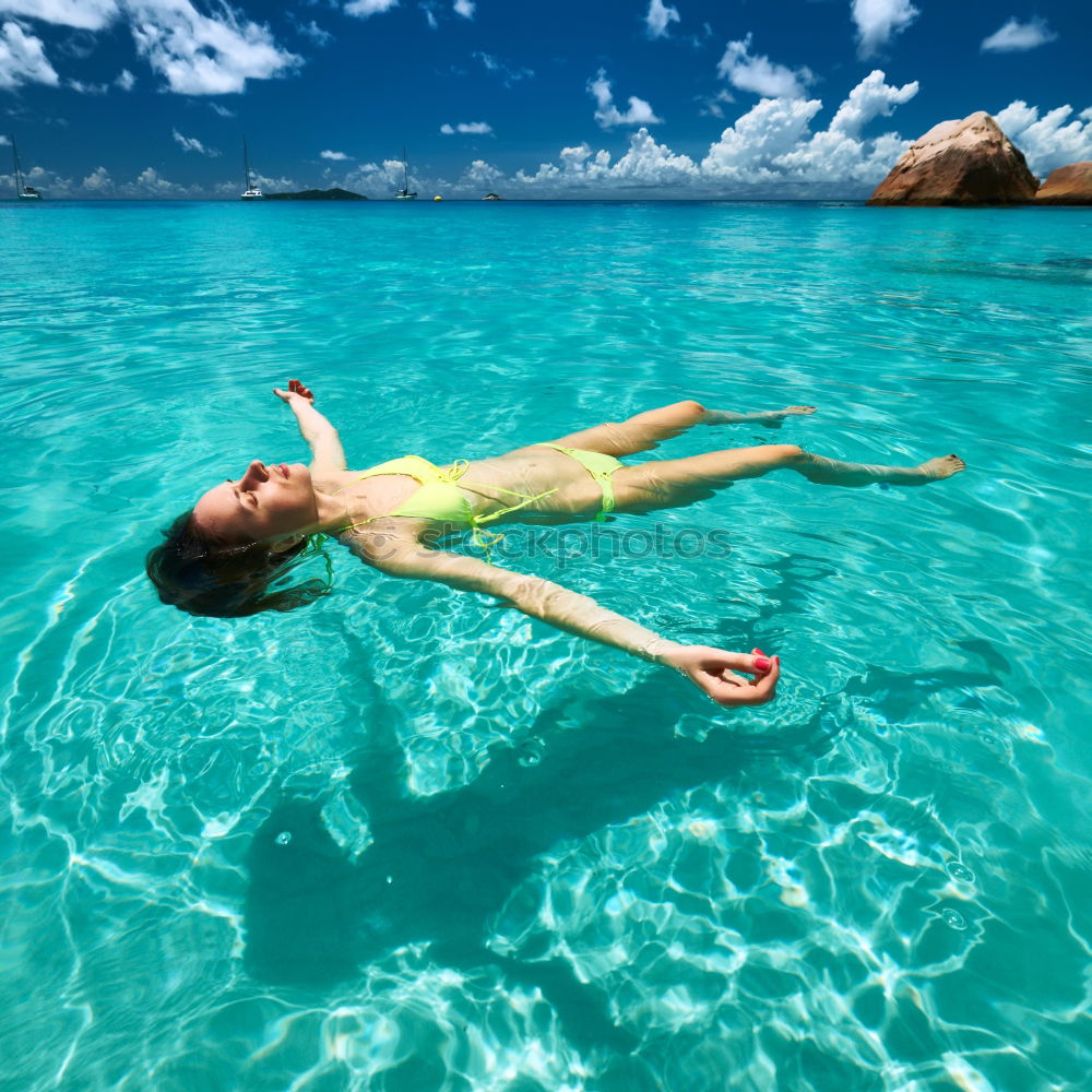 Similar – Woman in lagoon on tropical island