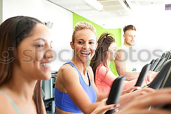 Similar – Image, Stock Photo Attractive Woman with headphones on treadmill in the gym