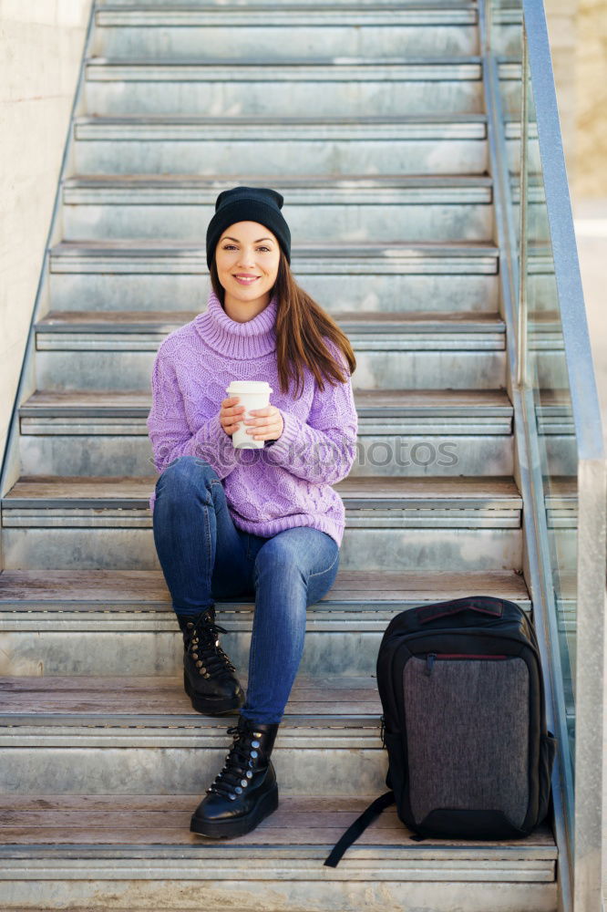 Similar – Attractive teenager sitting on steps in town