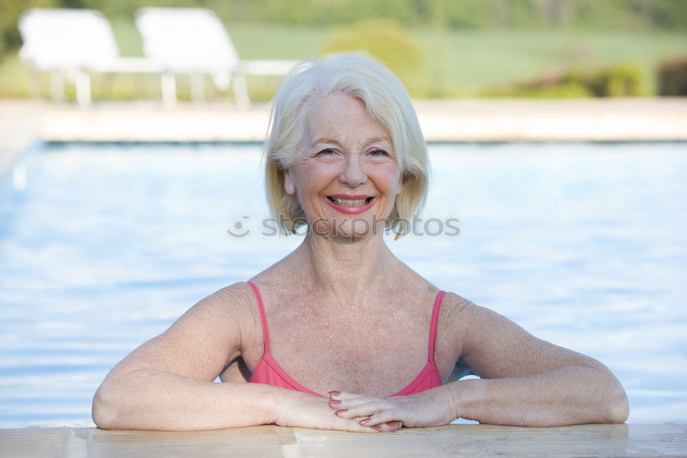 Similar – Ältere alte Frau graue Haare am Schwimmbad sitzend