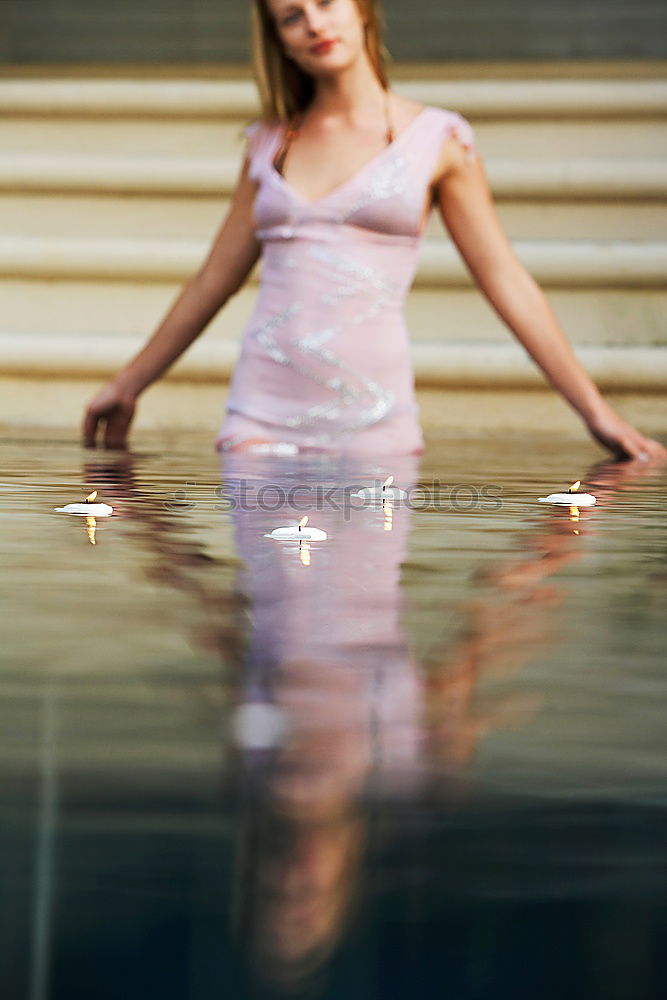 Similar – Woman with sunglasses plays with water