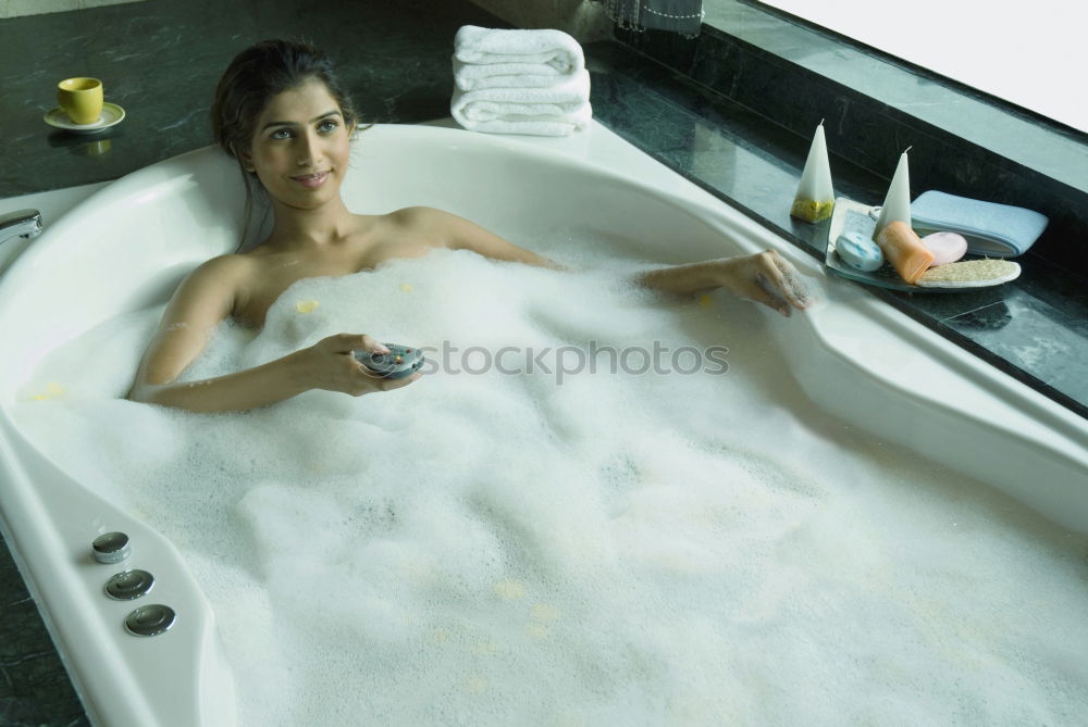 Similar – Woman lying in tub doing hydrotherapy treatment