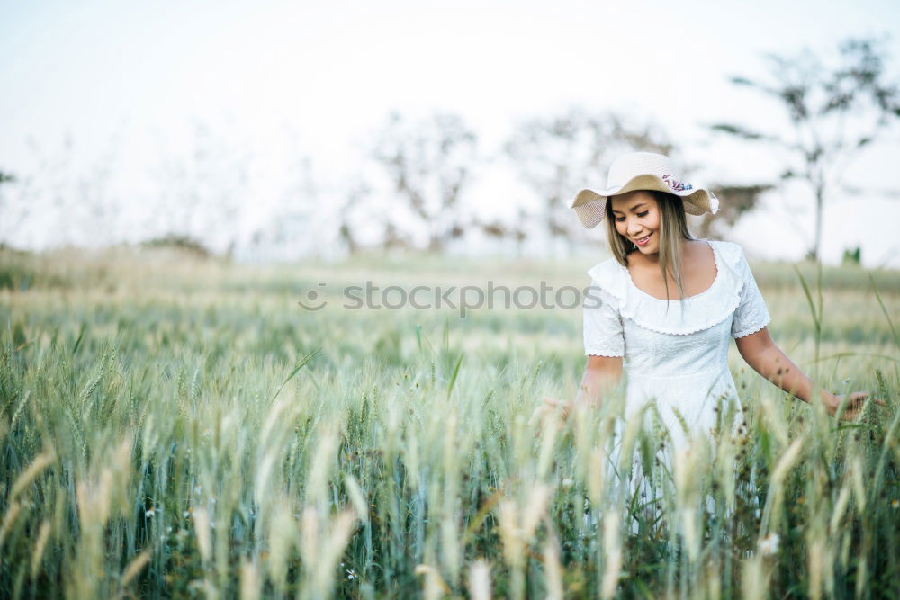 Similar – Woman in middle of wheat field