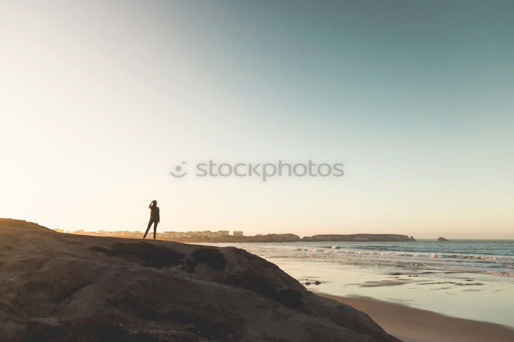 Similar – Image, Stock Photo Legs of man sitting at cliff