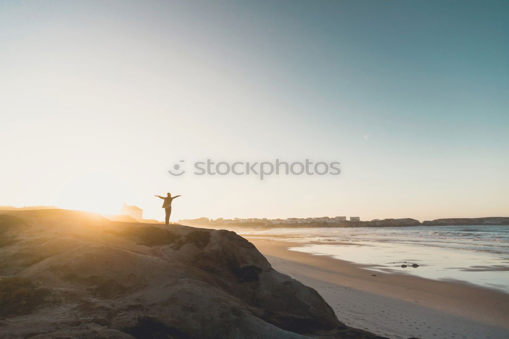 Similar – Image, Stock Photo Person on cliff on seashore