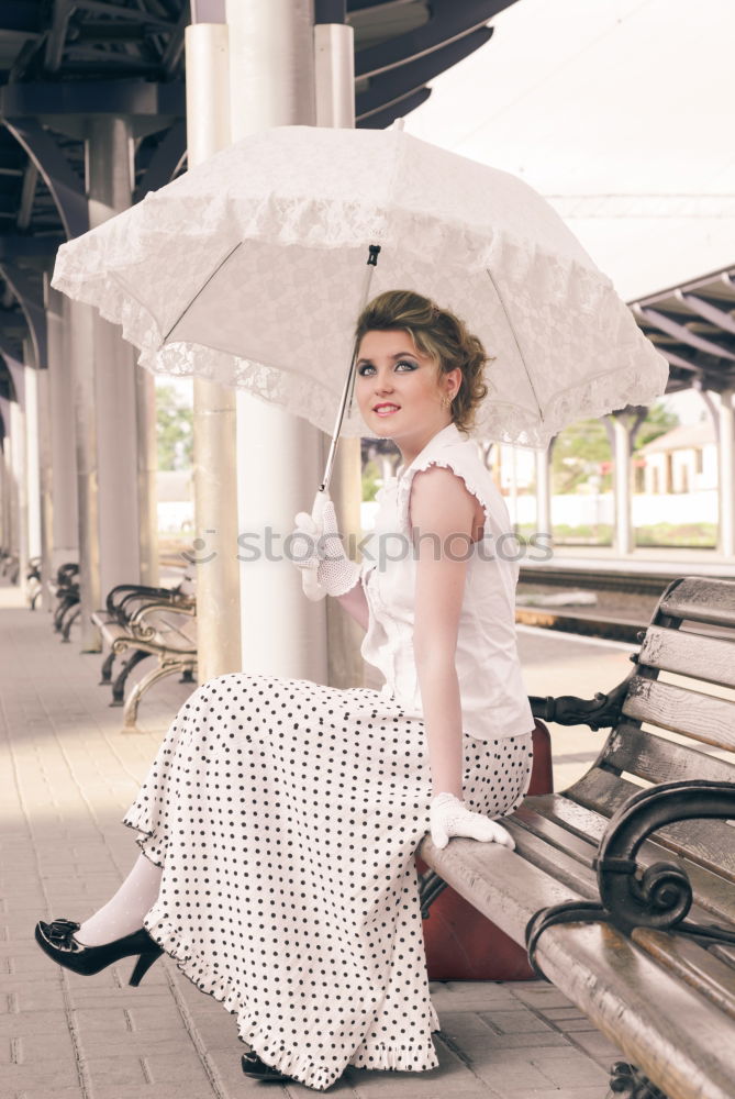 Similar – Girl waiting train on the platform of railway station