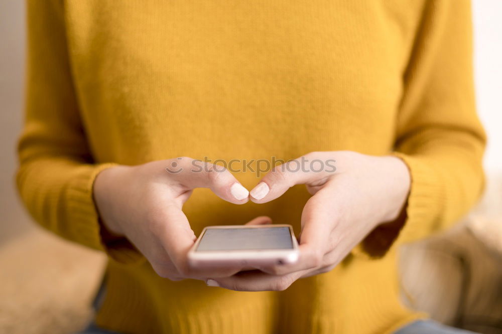 Similar – Closeup of woman’s hands using a smartphone