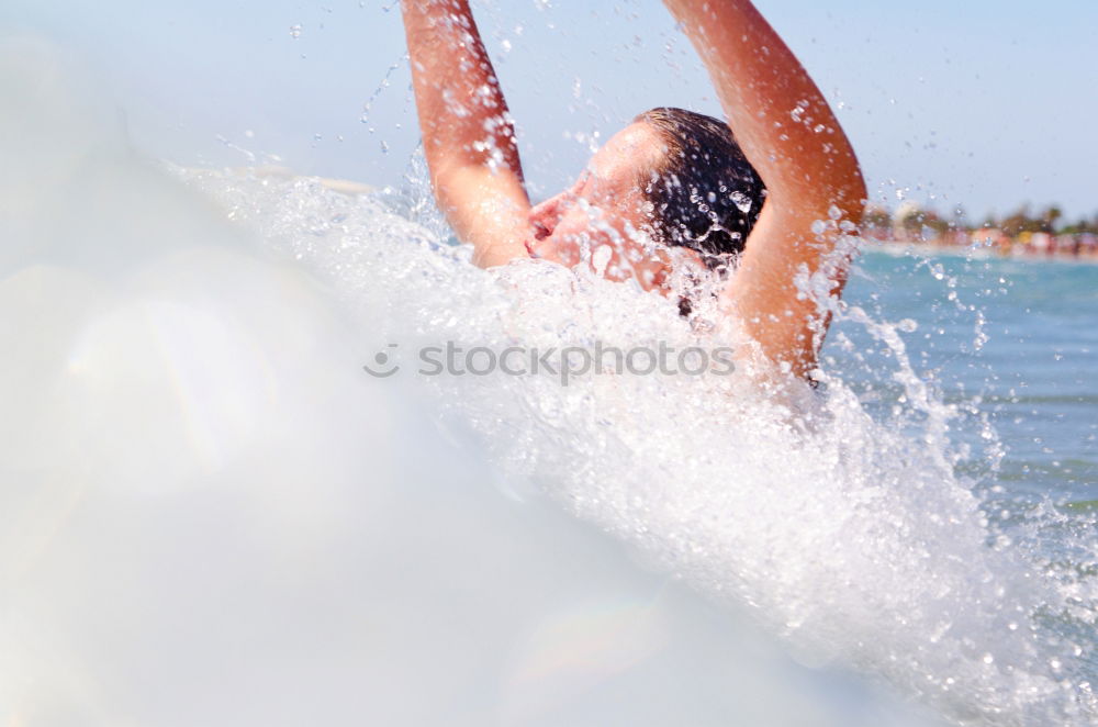 Similar – Image, Stock Photo Man in wetsuit swimming in ocean