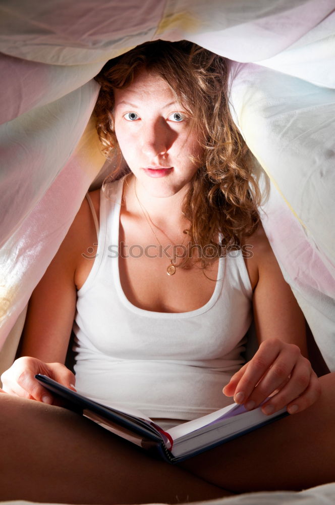 Image, Stock Photo Girl watching movie online on smartphone sitting on bed at home