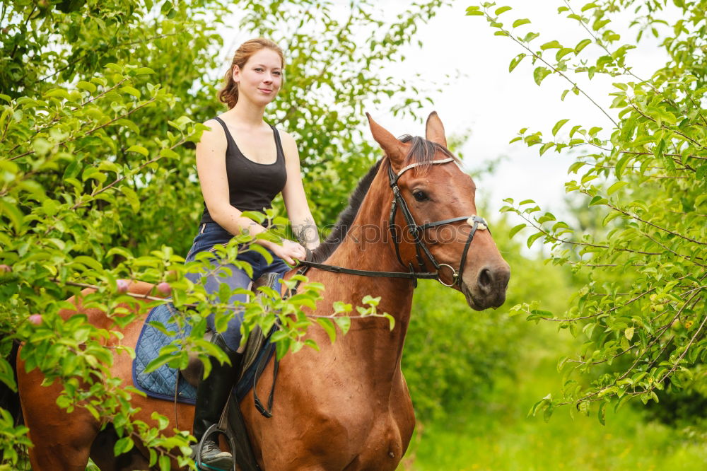 Similar – Image, Stock Photo Young woman riding a horse in nature