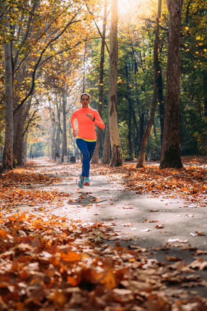 Image, Stock Photo Sporty woman running on a country road