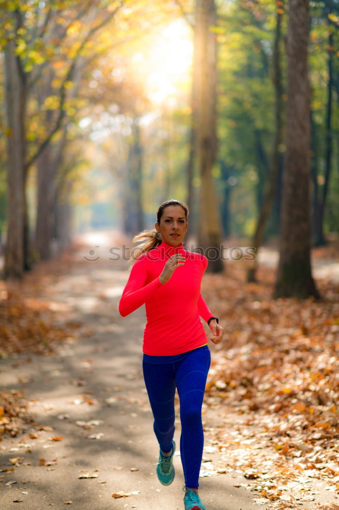 Similar – Image, Stock Photo Athletic woman out jogging in a forest