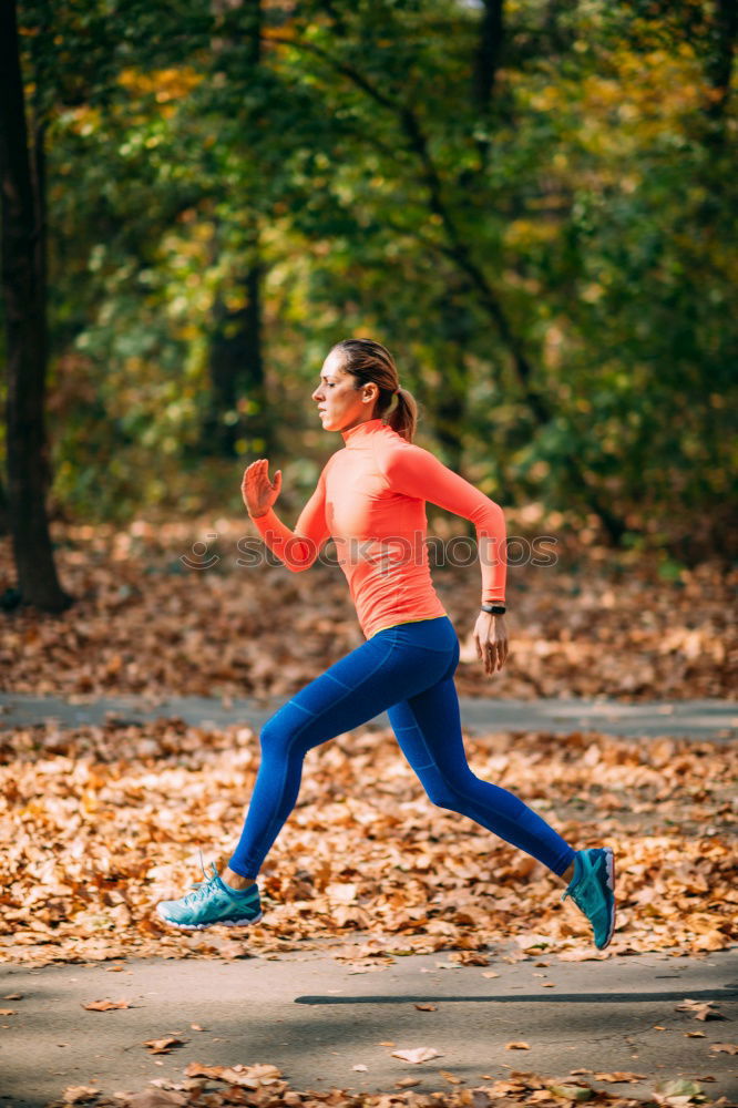 Similar – Image, Stock Photo Athletic woman out jogging in a forest