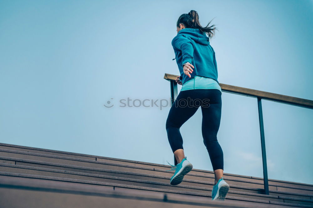 Similar – Young fitness woman runner stretching legs after run.