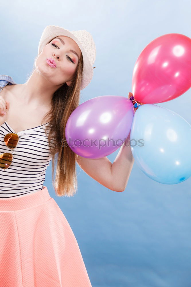 Similar – Image, Stock Photo Young woman holding colorful lollipops