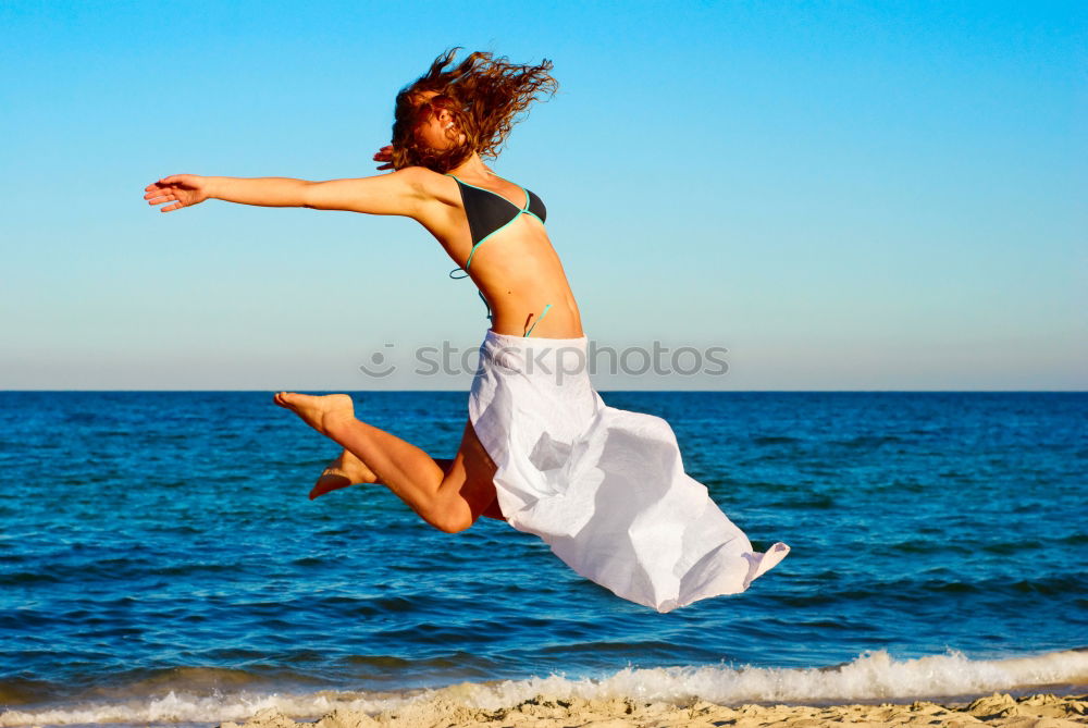 Similar – One happy little girl playing on the beach at the day time.