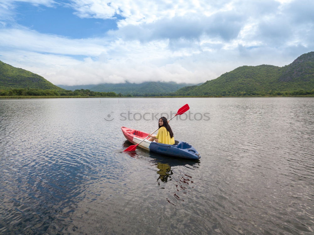 Similar – Unrecognizable woman on kayak exploring river