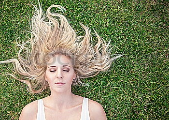 Similar – Image, Stock Photo Young woman lying down over a field of grass and pollen