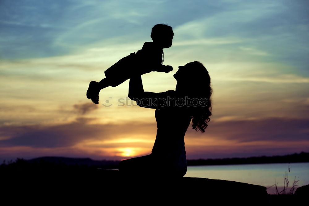 Similar – Father and son playing on the beach at the day time. Concept of friendly family.