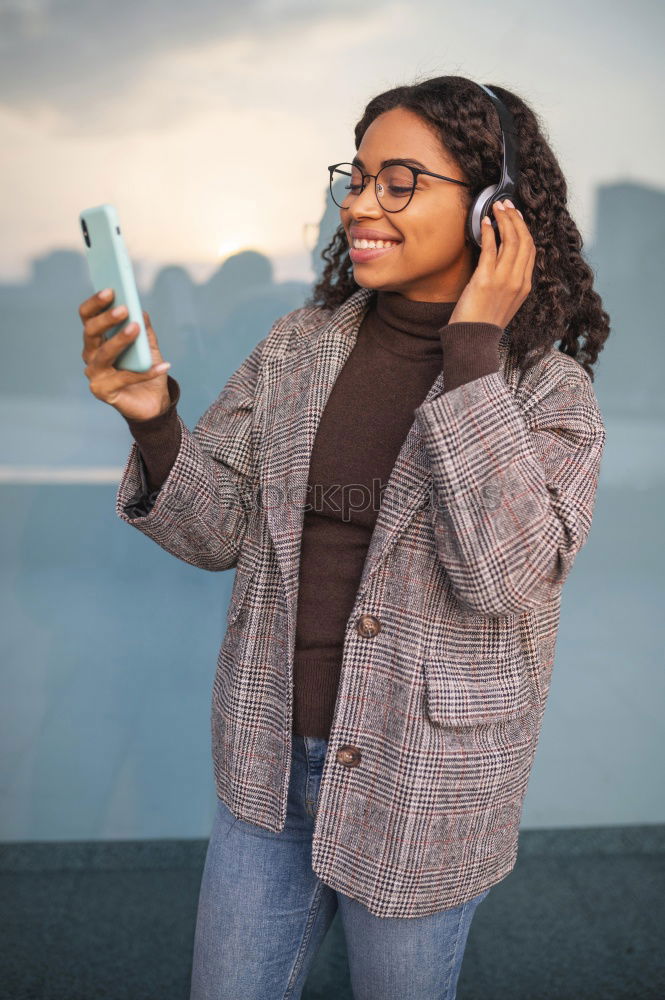 Front view of a young smiling african american woman standing