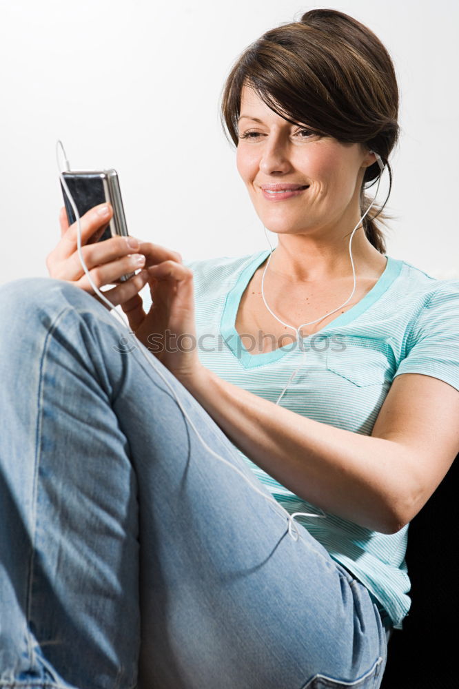 Similar – Young woman texting with a smartphone outdoors