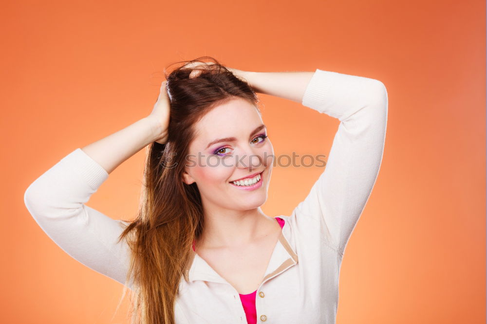 Similar – Image, Stock Photo Portrait of beautiful young woman using mobile phone in the street.