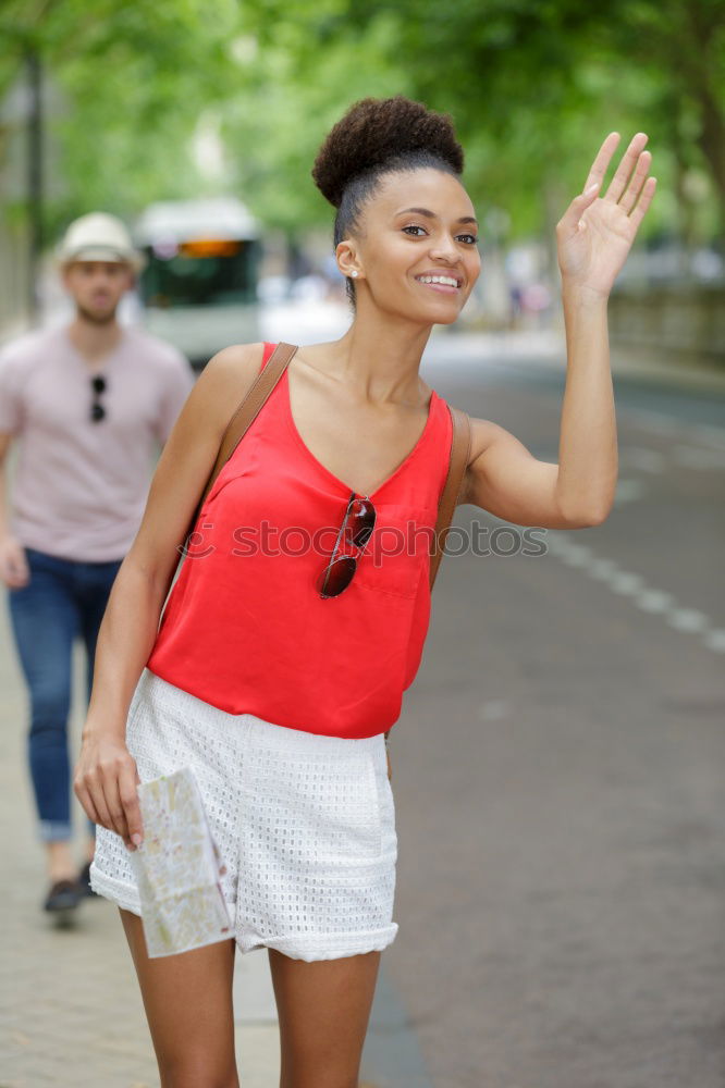 Similar – African woman texting with her smart phone.