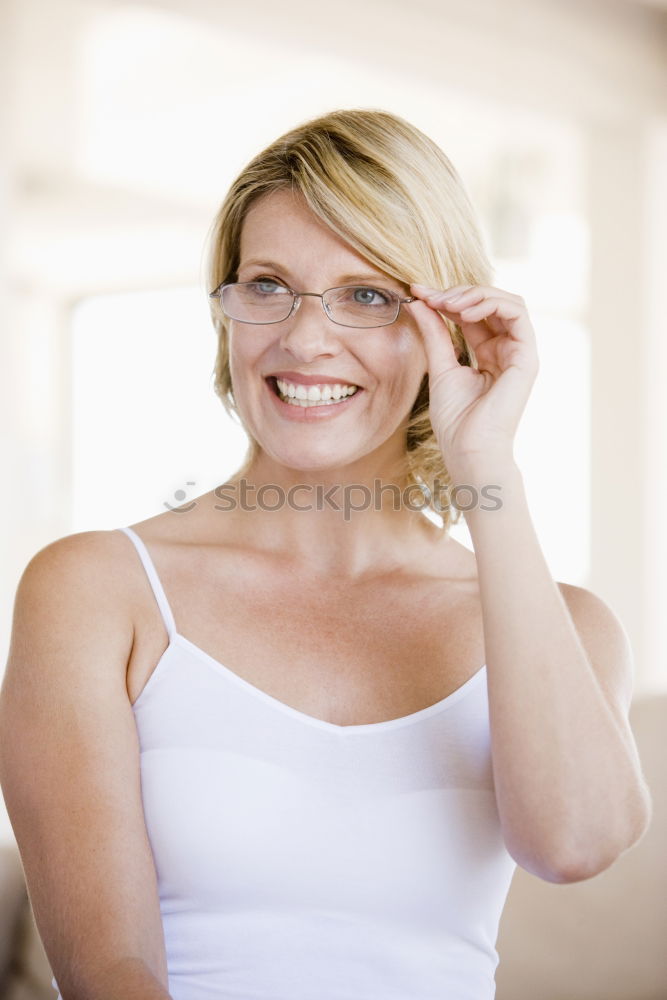 Similar – Image, Stock Photo young redheaded woman stands in front of a white door and smiles