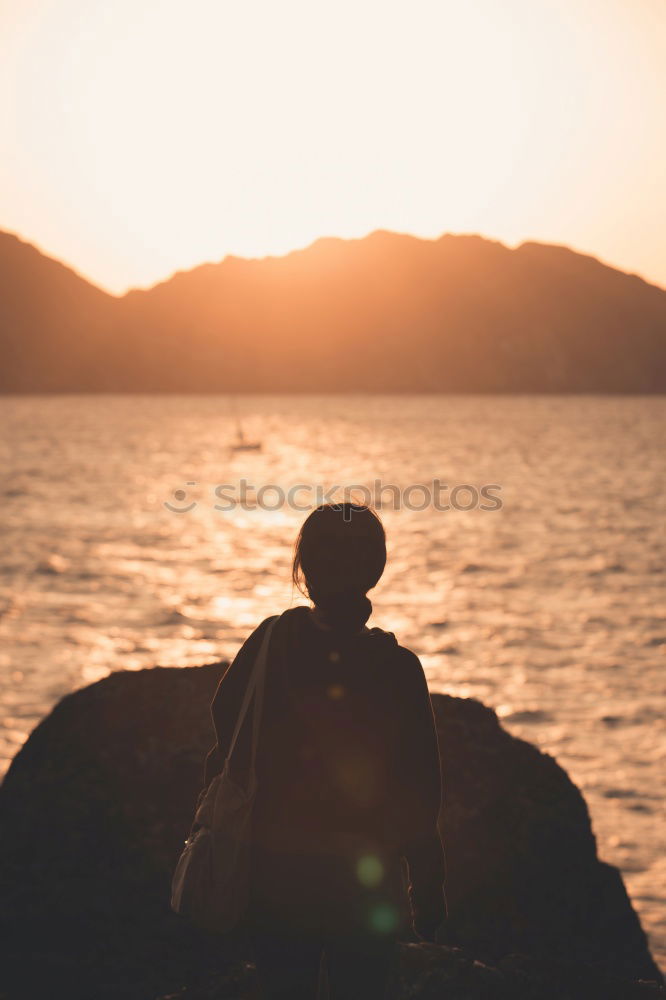 Similar – Image, Stock Photo Legs of man sitting at cliff