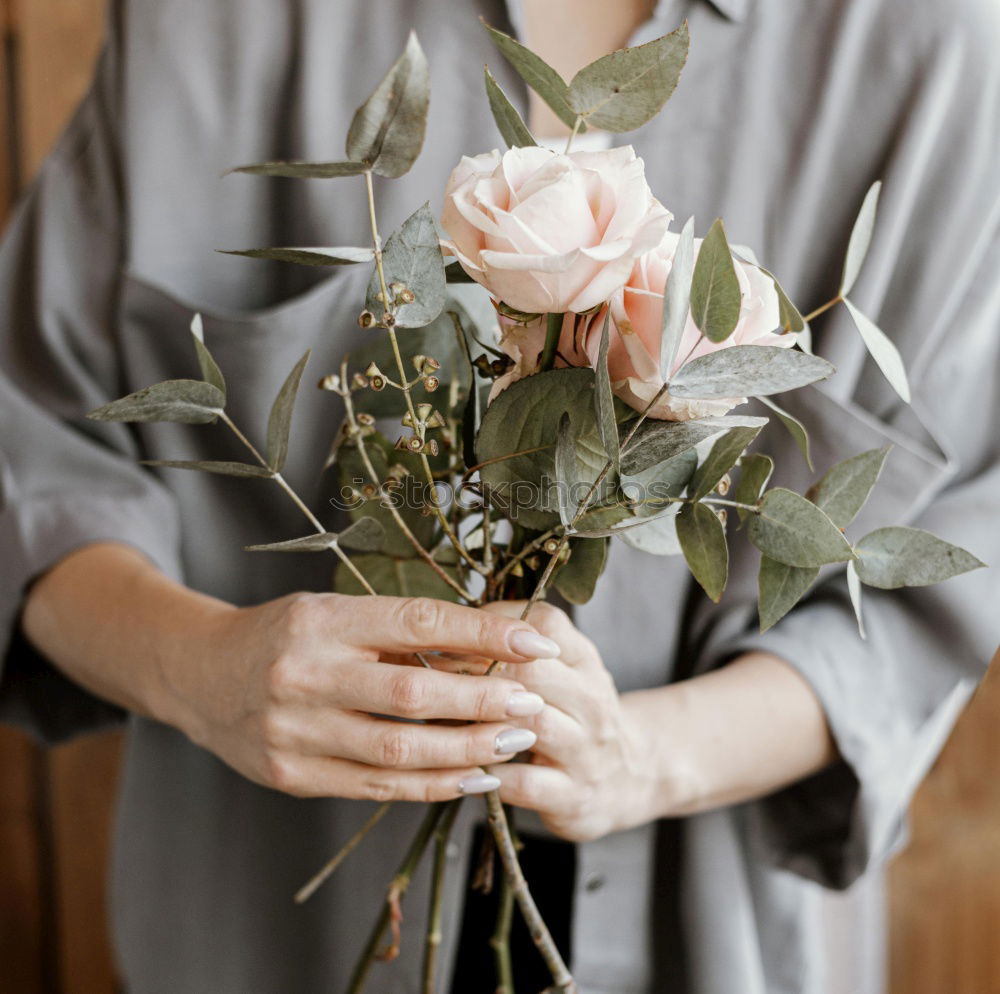 Similar – Female hand with roses bouquet of flowers