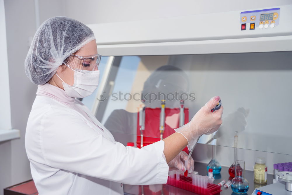 Similar – Image, Stock Photo Worker putting liquid to test tube